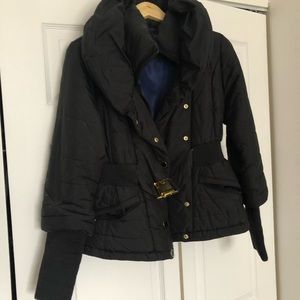 Black short Tahari jacket. Hits at the hips